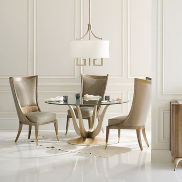 Rounding Up dining table shown fully with elegant chairs by Caracole