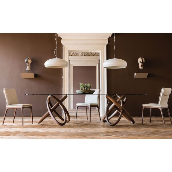 Carioca dining table shown in a complete showroom with beautiful dining chairs by Cattelan italia