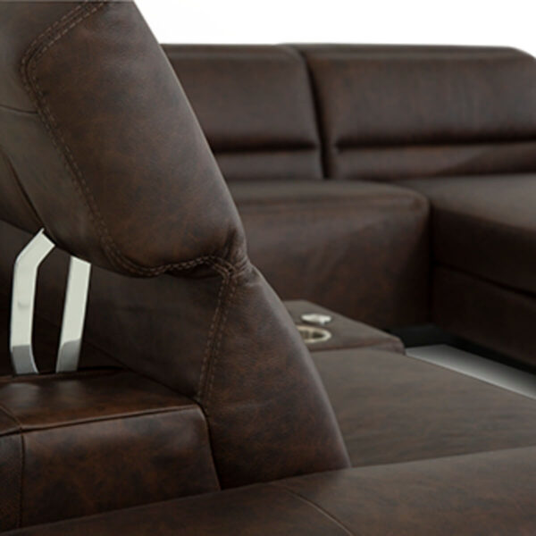 close up of power reclining headrest on chocolate color leather sectional showing stainless steel mechanism