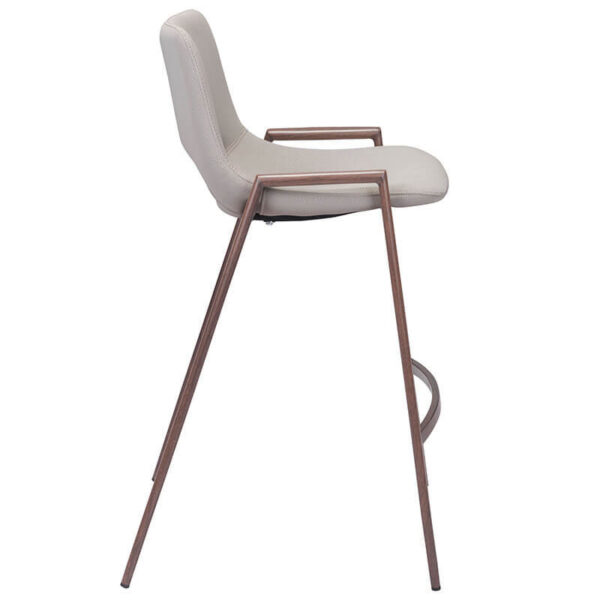 beige faux leather barstool with brown painted steel legs. oval opening in lower back of barstool seat. side profile
