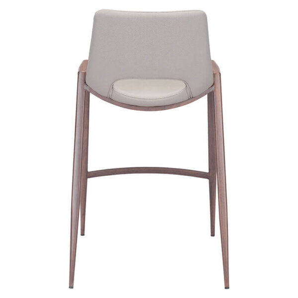 beige faux leather barstool with brown painted steel legs. oval opening in lower back of barstool seat. back side view