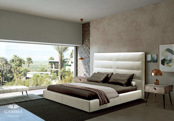 white leather bed staged in a contemporary bedroom