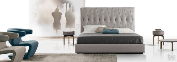 gray leather bed with cross tufting in a room setting