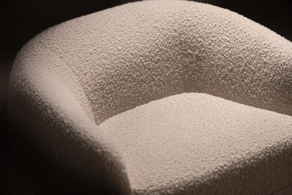 cream fabric arm chair with curve and swivel product image closeup