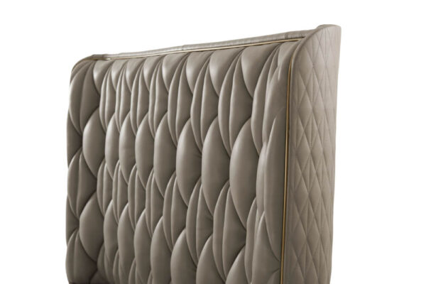 Quilted taupe leather king bed headboard.
