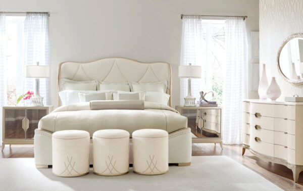 cream sleigh bed staged in neutral beige staged bedroom