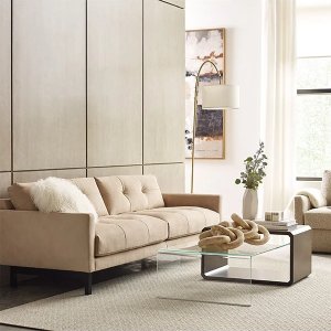 tan living room with two seat couch and chair with glass coffee table